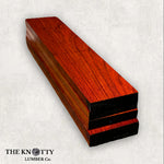 African Padauk wood lumber pack with vibrant red-brown color and a smooth finish
