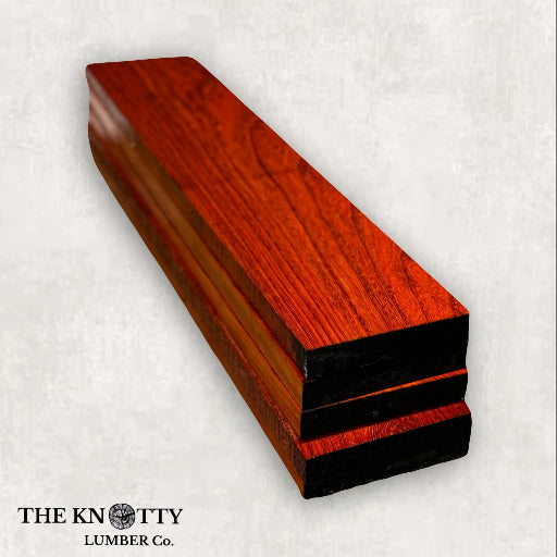 African Padauk wood lumber pack with vibrant red-brown color and a smooth finish