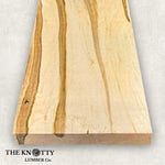 Ambrosia maple 4/4 hardwood image. A Wooden board with the grain and with 'The Knotty Lumber Co.' logo on a light gray background