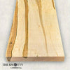 Ambrosia maple hardwood board with visible grain pattern on a light background, branded 'The Knotty Lumber Co'.