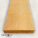 Yellow Birch 4/4, A Wooden board with the grain and with 'The Knotty Lumber Co.' logo on a light grey background