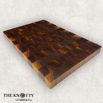 A top view of a Black Walnut wood butcher block end grain cutting board, branded with 'THE KNOTTY LUMBER CO.'