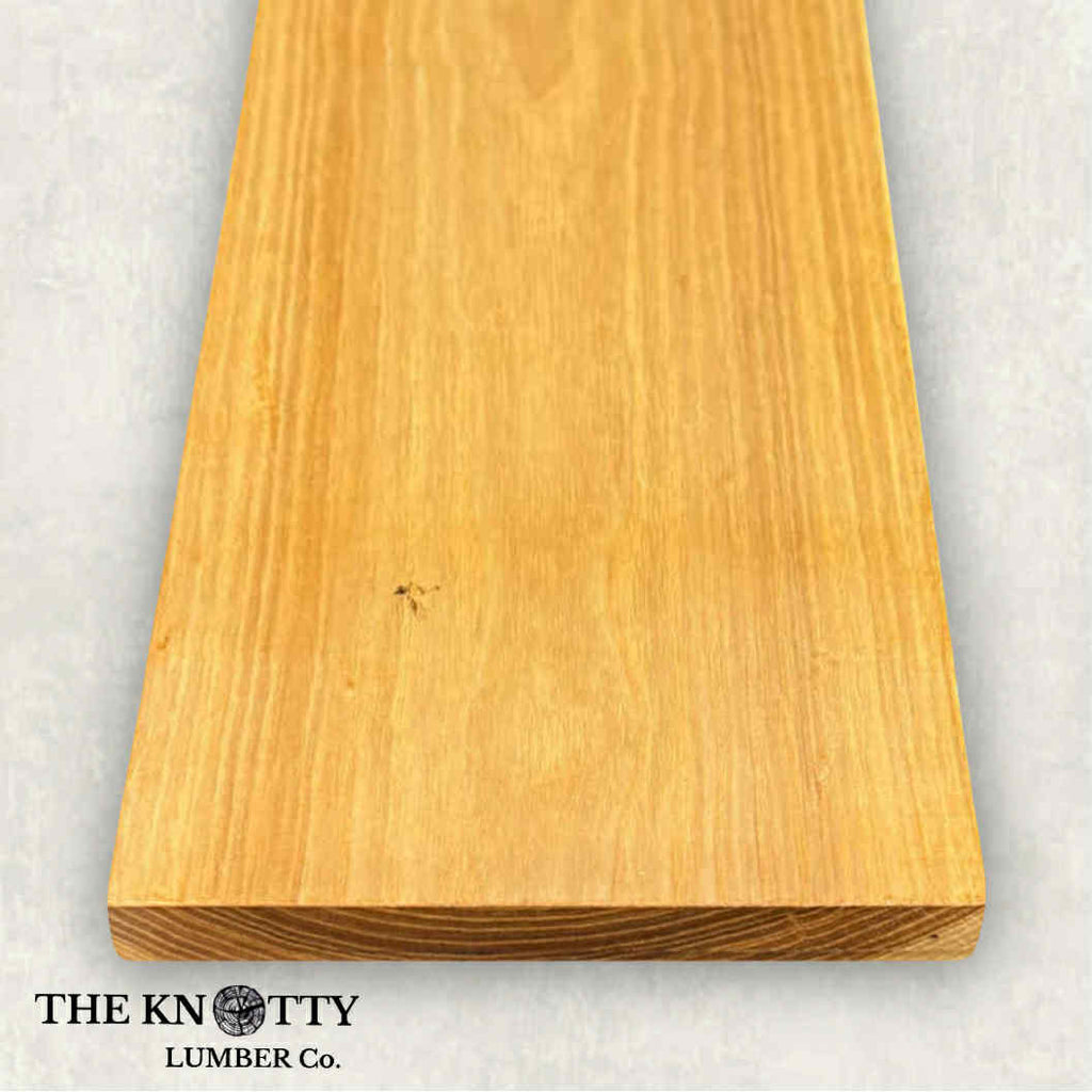 Hickory 4/4, A Wooden board with the grain and with 'The Knotty Lumber Co.' logo on a light grey background