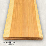 Hickory 4/4, A Wooden board with the grain and with 'The Knotty Lumber Co.' logo on a light grey background