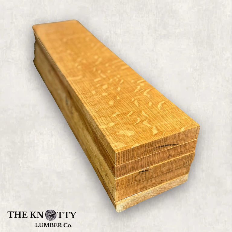 Quarter sawn white oak wood lumber pack with visible grain patterns and a light creamy hue.