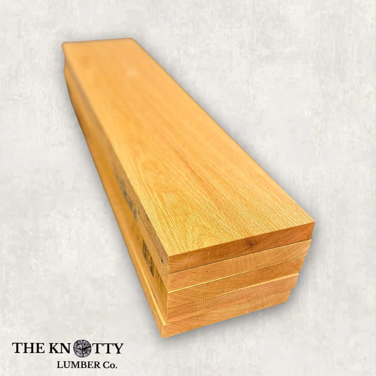 Red Oak wood lumber pack boards with visible natural grain patterns.