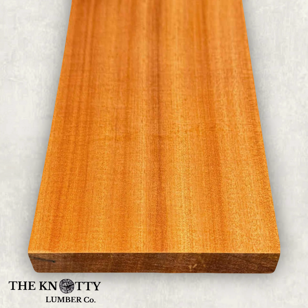 Sapele 4/4, A Wooden board with the grain and with 'The Knotty Lumber Co.' logo on a light grey background