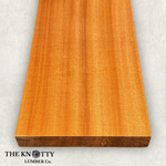 Sapele 4/4, A Wooden board with the grain and with 'The Knotty Lumber Co.' logo on a light grey background