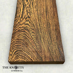 Wenge 4/4 Wooden board with visible grain pattern on a white background, branded 'The Knotty Lumber Co'.