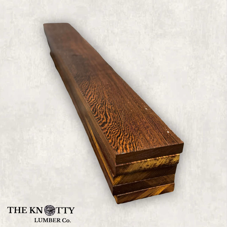 Wenge lumber pack with a rich dark brown color and visible wood grain, cut to thicknesses for woodworking projects.