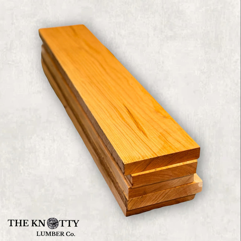 cherry wood lumber pack with visible wood grain, prepared for crafting.