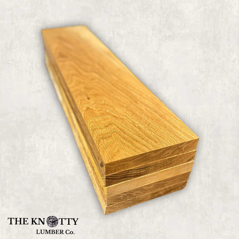 flatsawn white oak lumber pack with a light golden-brown color and visible grain patterns, labeled with 'THE KNOTTY LUMBER CO.'.