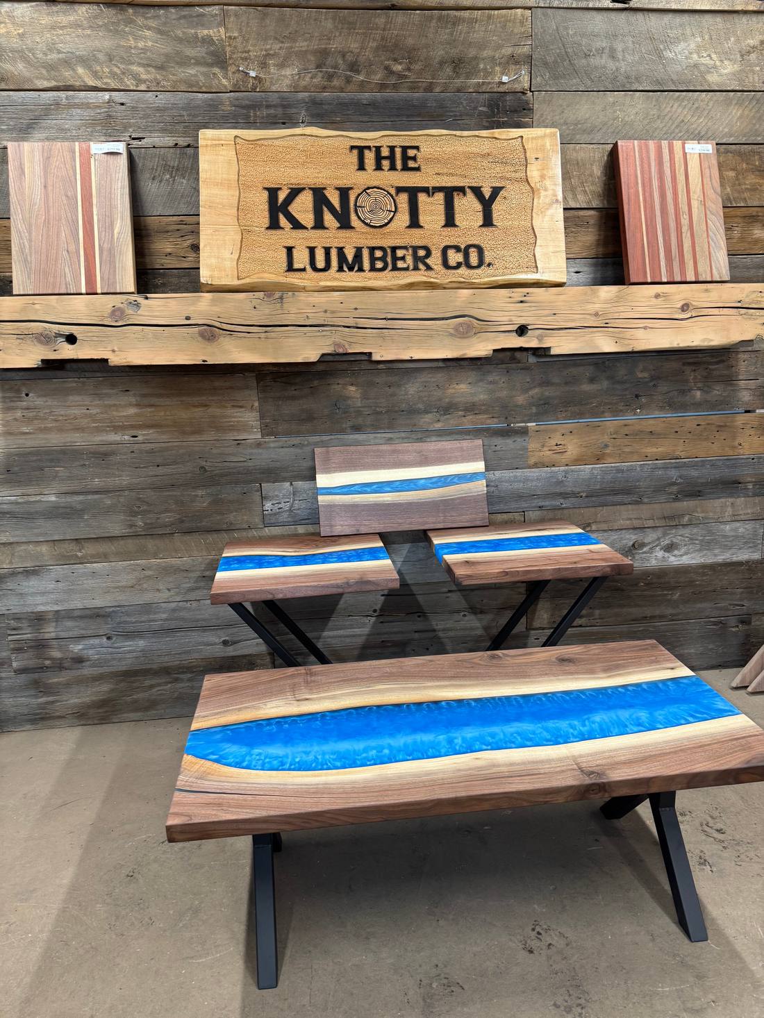 Matched blue resin coffee table, benches and serving boards