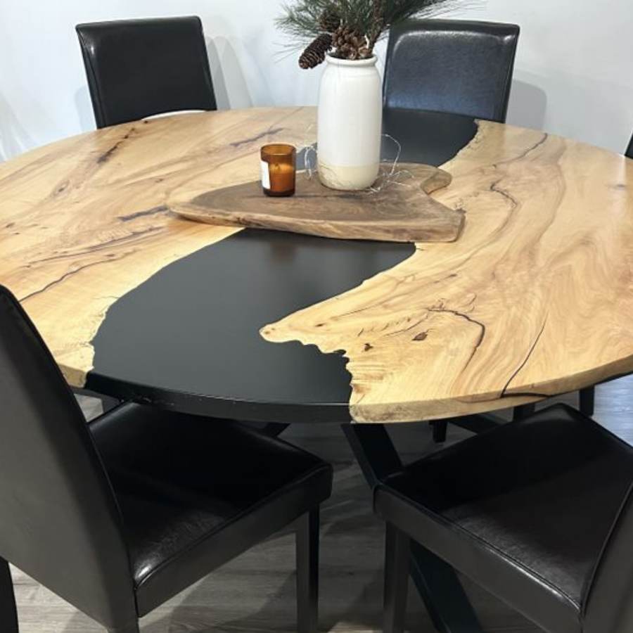 Round live edge dining table with a black resin river